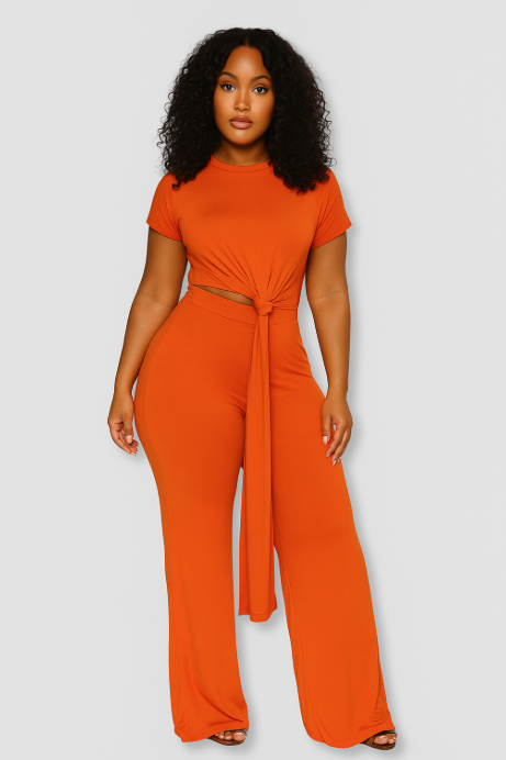 Woman wearing an orange jumpsuit on a white background