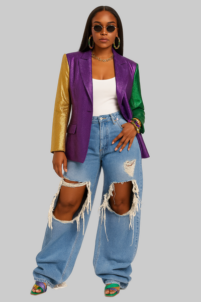 Person wearing a colorful jacket, white top, and ripped jeans on a white background