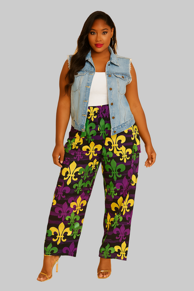 Woman wearing a denim vest over a white top with colorful pants featuring yellow and green patterns on a beige background