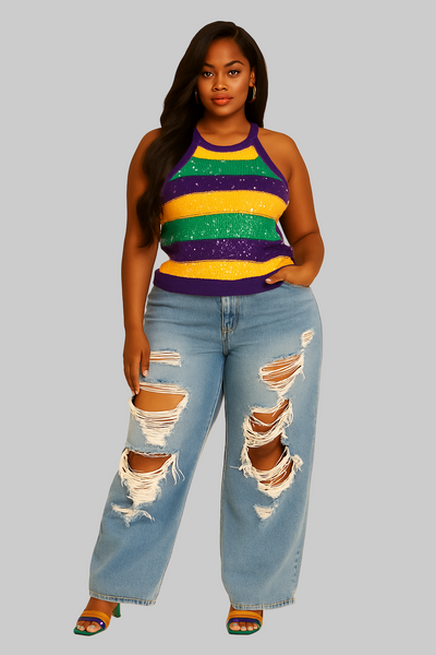 Woman wearing a colorful striped top and ripped jeans on a beige background