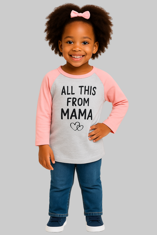 Child wearing a shirt with 'All This From Mama' text on a plain background