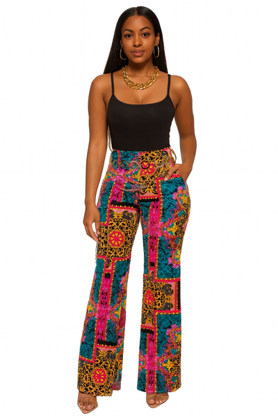 Woman wearing colorful patterned pants on a white background