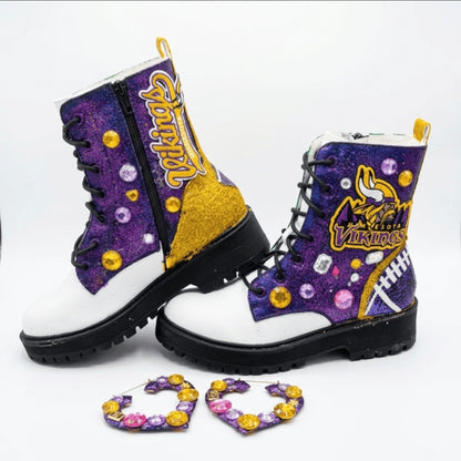 Decorative boots with Viking logo and purple glittery design on a white background