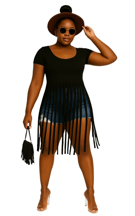 Woman wearing a black top and denim skirt with fringe on a white background