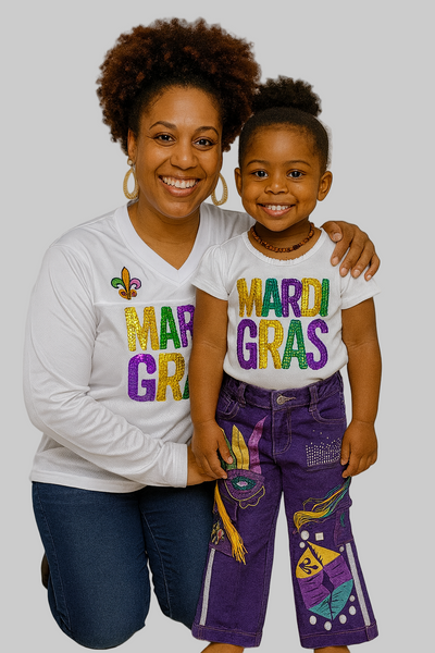 Woman and child wearing Mardi Gras-themed shirts and pants on a plain background
