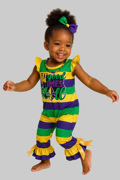 Child wearing a colorful outfit with ruffles on a plain background