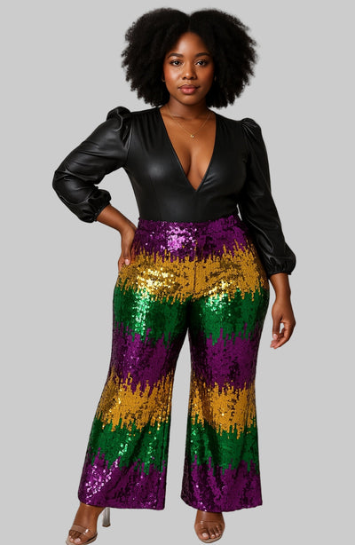A pair of wide-leg sequin pants with a pattern of purple, green, and gold colors, traditional Mardi Gras colors.
