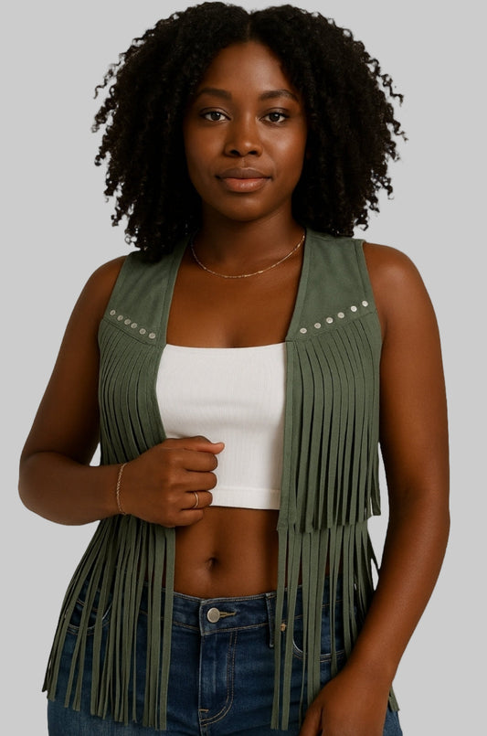 A woman wearing a bohemian-inspired sleeveless tassel vest in olive green color with fringe detailing and metallic embellishments on the chest.